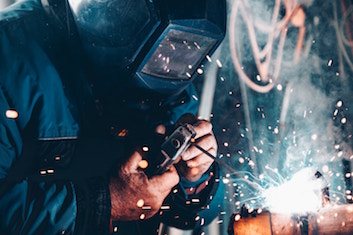 White-hot sparks from a welder’s torch.