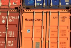 Close up of codes printed on stacked shipping containers